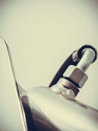 Agriculture equipment concept. Industrial detaild pneumatic, hydraulic red and silver machinery made of steel.の写真素材