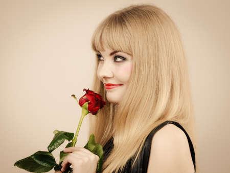 Glamour and fashion. Gorgeous lovely charming young lady portrait. Smiling attractive blonde stylish woman with strong make up.の写真素材