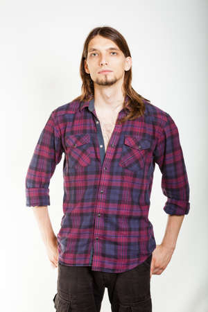 Masculinity concept. Man in plaid shirt. Young male posing on white background.