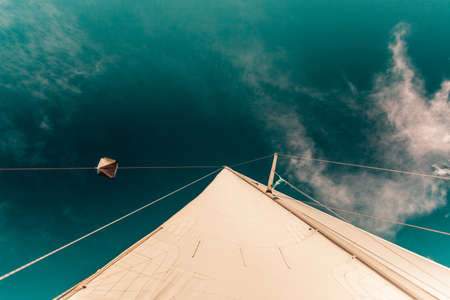 Detailed closeup of sail fabric on sailboat, outdoor shot. Marine objects concept.の写真素材