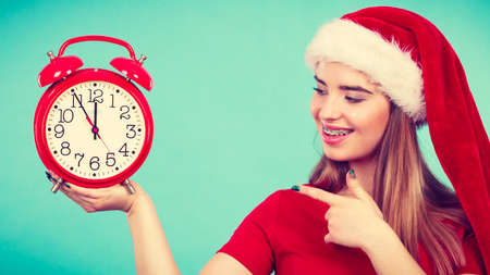 Xmas, seasonal clothing, christmas time concept. Happy woman wearing Santa Claus helper costume...