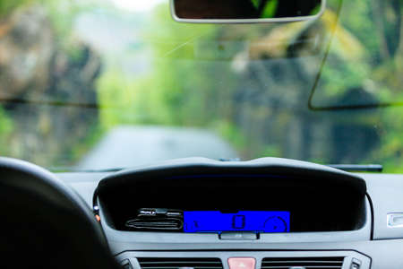 Car driving, view from inside on dashboard and window. Traveling using vehicles concept.