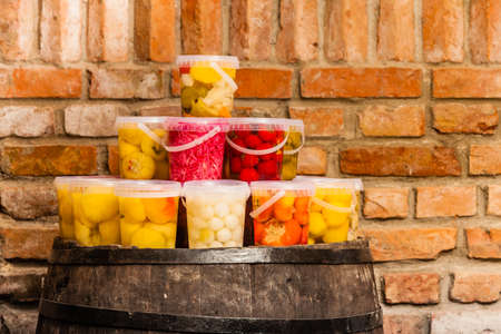 Food preserving for autumn winter time. Jars with pickled vegetables in cellarの写真素材