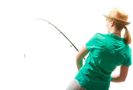 Fishery, spinning equipment, angling sport and activity concept. Woman with fishing rod.の写真素材