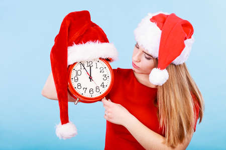 Xmas, seasonal clothing, christmas time concept. Happy woman wearing Santa Claus helper costume...