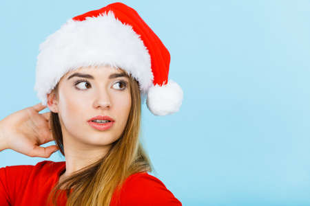 Xmas, seasonal clothing, winter christmas concept. Young neutral confident woman wearing Santa Claus helper costumeの写真素材