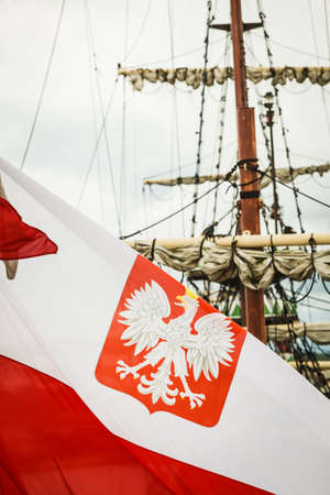 Closeup of polish national flag with eagle emblem on ship in marine.のeditorial素材