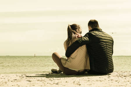 Romance, beautiful relantionship concept. Happy couple having date on beach near sea.の写真素材