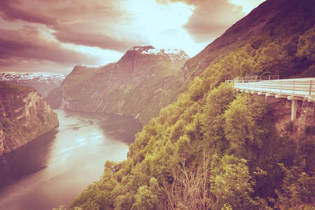 Tourism vacation and travel. Beautiful view over magical Geirangerfjorden from Flydalsjuvet viewpoint, Norway Scandinavia.の写真素材