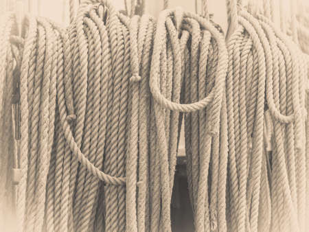 Old fashioned harbor marina sail boat ropes. Yachting details and objects concept.の写真素材