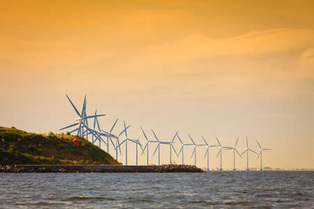 Wind turbines generator farm for renewable sustainable and alternative energy production along coast...