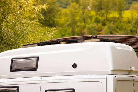 Tourism, travel and holiday trip in motorhome. Camper van and nature landscape.