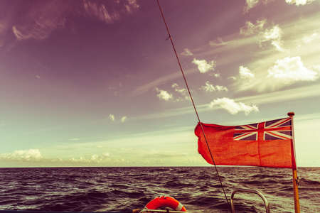 Water traveling, adventure concept. Sea view from yacht, calm water, sunny weather, sky with many clouds.の写真素材