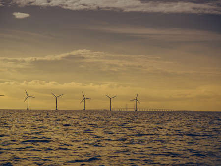 Wind turbines generator farm for renewable sustainable and alternative energy production along coast baltic sea near Denmark. Eco power, ecology.のeditorial素材