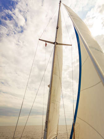 Detailed closeup of sail fabric on sailboat, outdoor shot. Marine objects concept.の写真素材