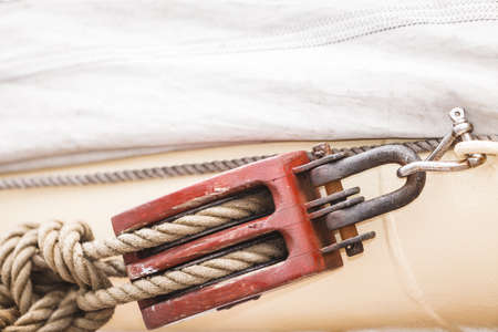 Jetty objects concept. Harbor marina block bolt with ship and boats ropes, outdoor shotの写真素材