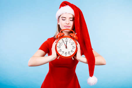 Xmas, seasonal clothing, christmas time concept. Happy woman wearing Santa Claus helper costume...
