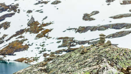 Tourism holidays and travel. Stones stack on Djupvatnet lake in Stranda More og Romsdal, Norway Scandinavia.の写真素材