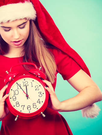Xmas, seasonal clothing, christmas time concept. Happy woman wearing Santa Claus helper costume...