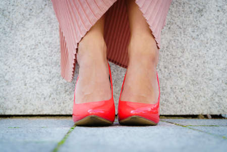 Fashion and footwear. Red high heel classic shoes outdoor during sunny day.の写真素材