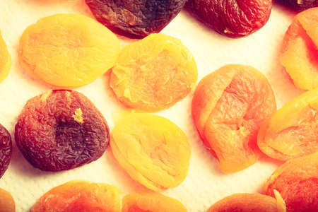 Food concept. Detailed closeup of dried apricots in different shades of orangeの写真素材