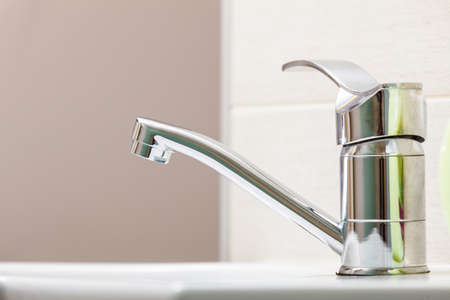 Hygiene in workplace concept. Focused sink with candle in beautician spa salonの写真素材