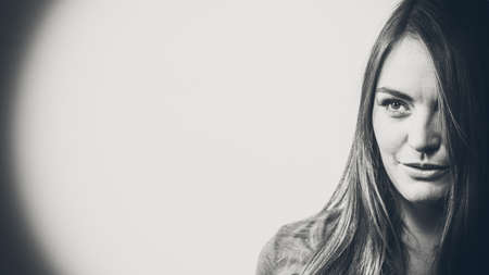Portrait of young woman lonf hair, black and white photoの写真素材