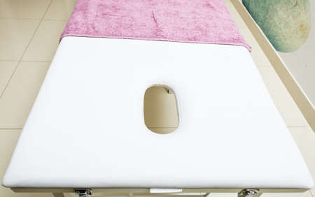 Profession workplace equipment concept. Professional clean bed in beautician spa salon ready for next client.の写真素材