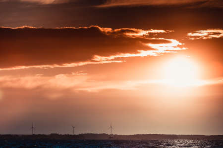 Wind turbines power generator farm for renewable energy production along coast baltic sea near denmark. Aternative green clean energy, ecology.の写真素材