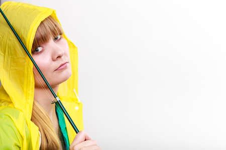 Fishery, spinning equipment, angling sport and activity concept. Woman wearing raincoat holding...
