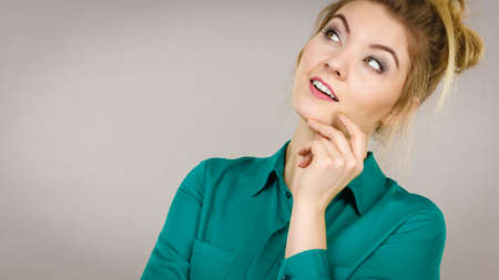 Young business woman wearing jacket intensive thinking finding great problem solution and ideas.