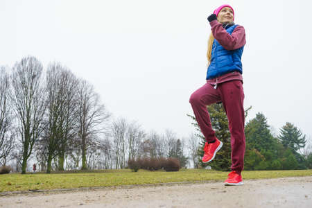 Fit woman jogging outdoor.