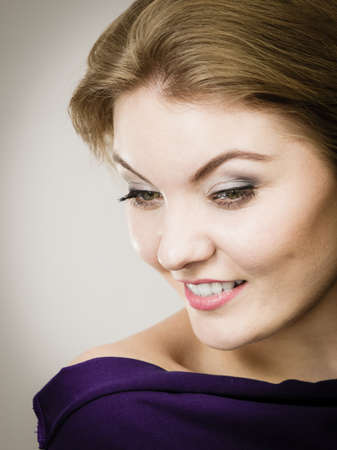 Close up portrait of beautiful woman having make up, perfect skin complexion and blonde hair.の写真素材