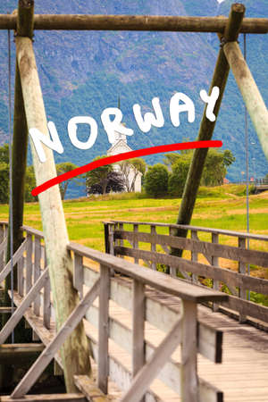 Mountain landscape and the white wooden Oppstryn Church in Stryn Municipality in Sogn og Fjordane county, Norway.の写真素材