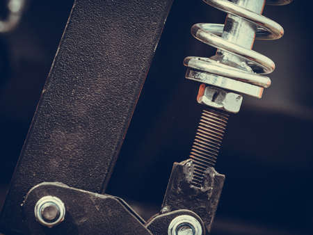 Pump, device, detail closeup concept. Big, hard made of steel spring on machineryの写真素材