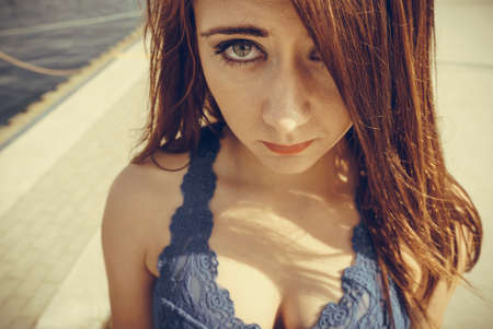 Human expressions concept. Closeup of woman making sad face looking depressed and shy.の写真素材