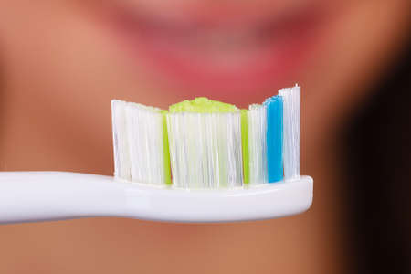 Dentistry, dental oral hygiene, bathroom objects concept. Detailed closeup of clean traditional manual toothbrushの写真素材