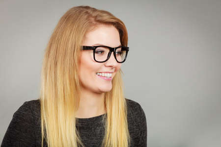 Happiness face expressions concept. Portrait of happy cheerful blonde woman smiling with joyの写真素材