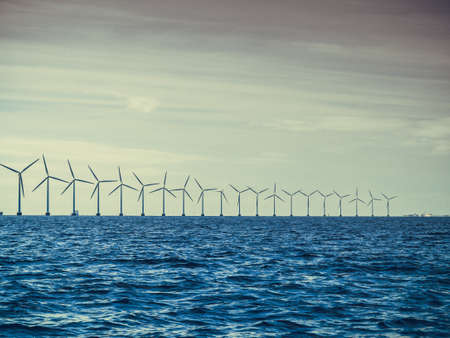 Wind turbines generator farm for renewable sustainable and alternative energy production along coast...