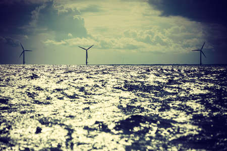 Wind turbines generator farm for renewable sustainable and alternative energy production along coast baltic sea near Denmark. Eco power, ecology.の写真素材