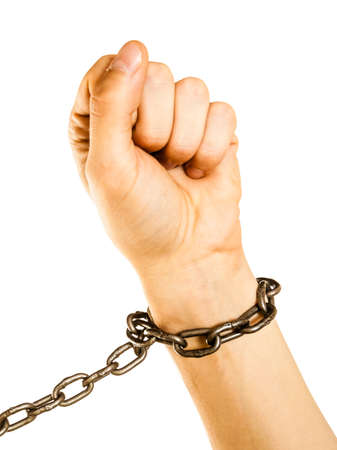 Lack of freedom, social problems concept. Chained man hands with chain around wrists