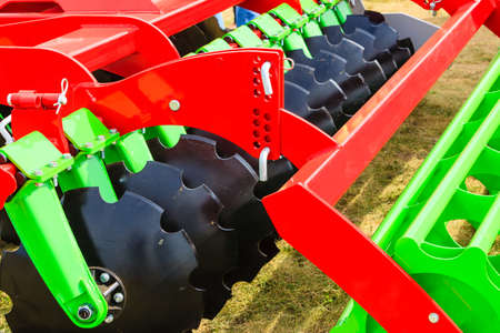 Agriculture equipment concept. Detailed closeup of disc harrow, agricultural machinery. Outdoor shotの写真素材