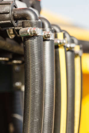 Industrial detailed pneumatic, hydraulic machinery concept. Pump made of steel on machine closeup.の写真素材