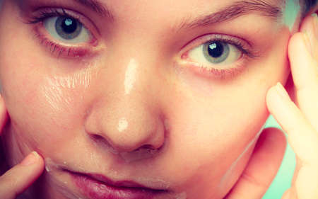 Close up young woman in facial peel off mask. Peeling. Beauty and skin care.の写真素材