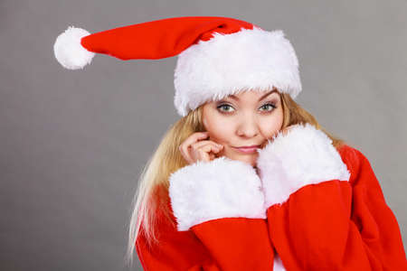 Xmas, seasonal clothing, winter christmas concept. Happy woman wearing Santa Claus helper costumeの写真素材
