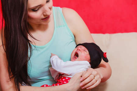Family parenting, beauty of motherhood concept. Mother holding her little newborn babyの写真素材