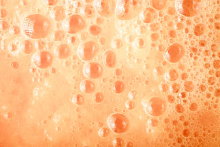Diet healthy nutrition. Fresh fruits juice background texture. Orange water bubbles. Macroの写真素材
