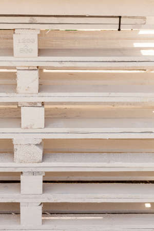 Delivery, fabrication, wooden fabric concept. Detailed closeup, euro pallets made of light wood.の写真素材