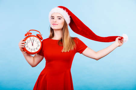 Xmas, seasonal clothing, christmas time concept. Happy woman wearing Santa Claus helper costume...