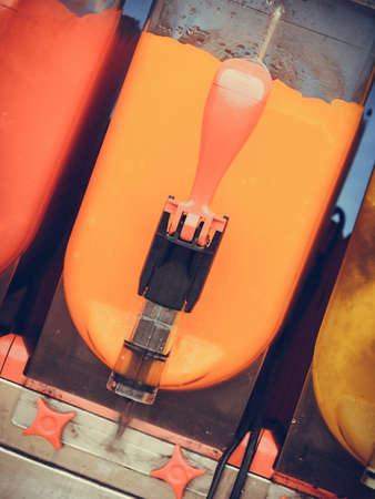 Food, cold sweet desert, summertime pleasure concept. Colorful ice cream slushy smoothie machineの写真素材